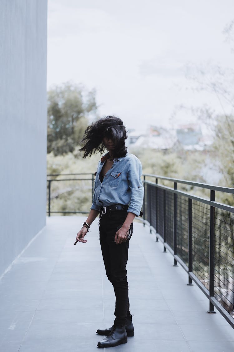 A Man Flipping His Long Hair