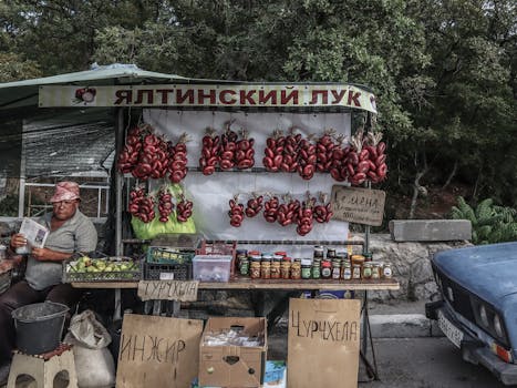 Outdoor market stall selling Yalta onions and homemade products. Perfect depiction of local street commerce.