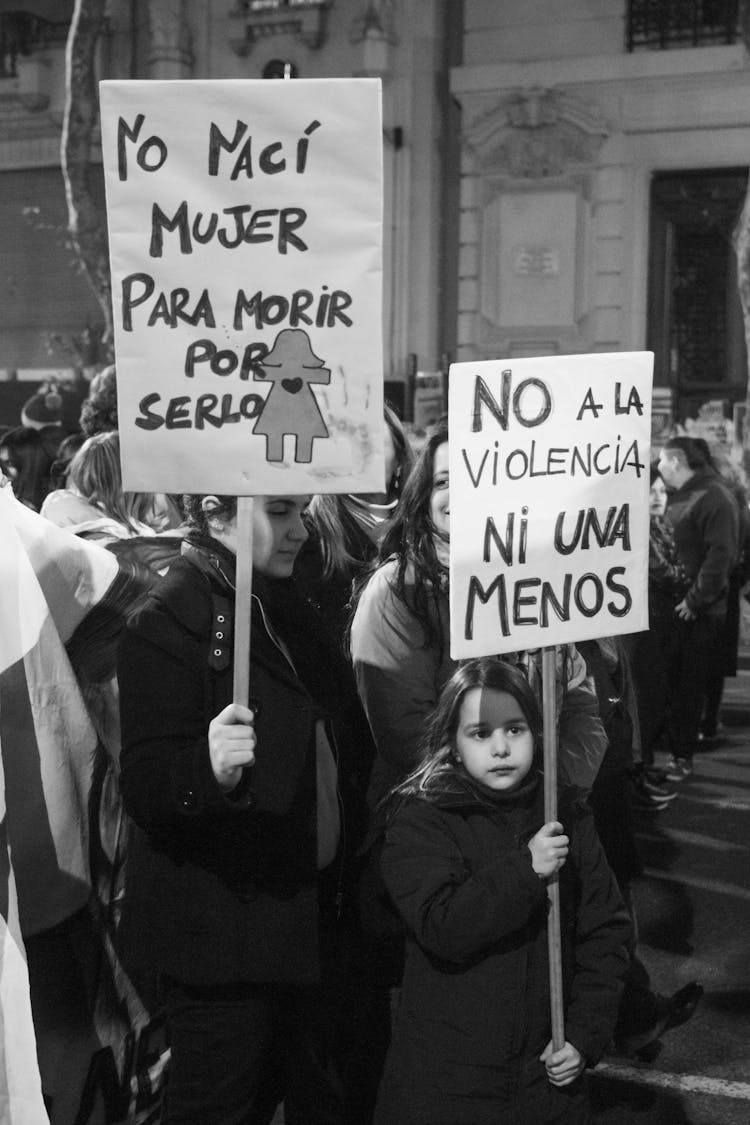 Grayscale Photo Of Women Holding Signs