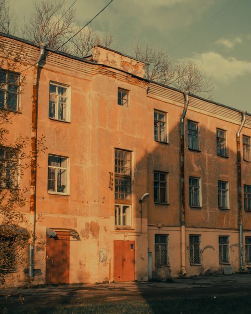 Free A vintage facade of an apartment building with artistic decay and natural lighting. Stock Photo