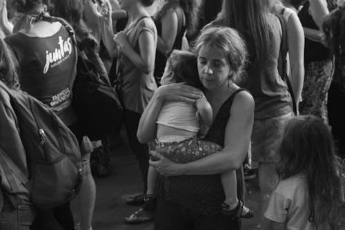 Free Grayscale Photo of Mother carrying her Child  Stock Photo