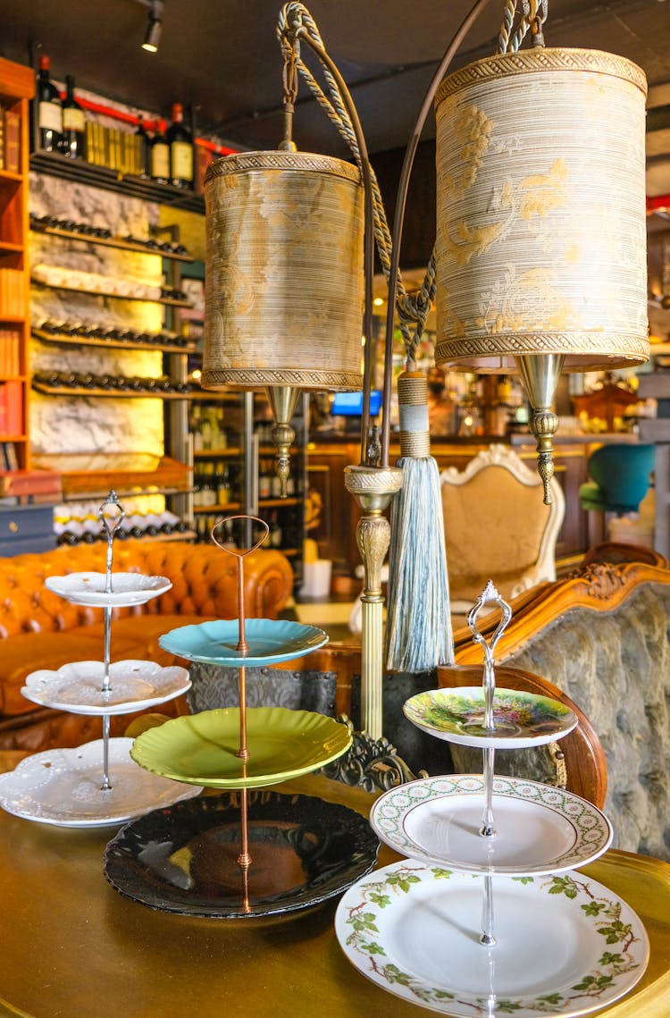 Ceramic Cupcake Stands Beside A Floor Lamp