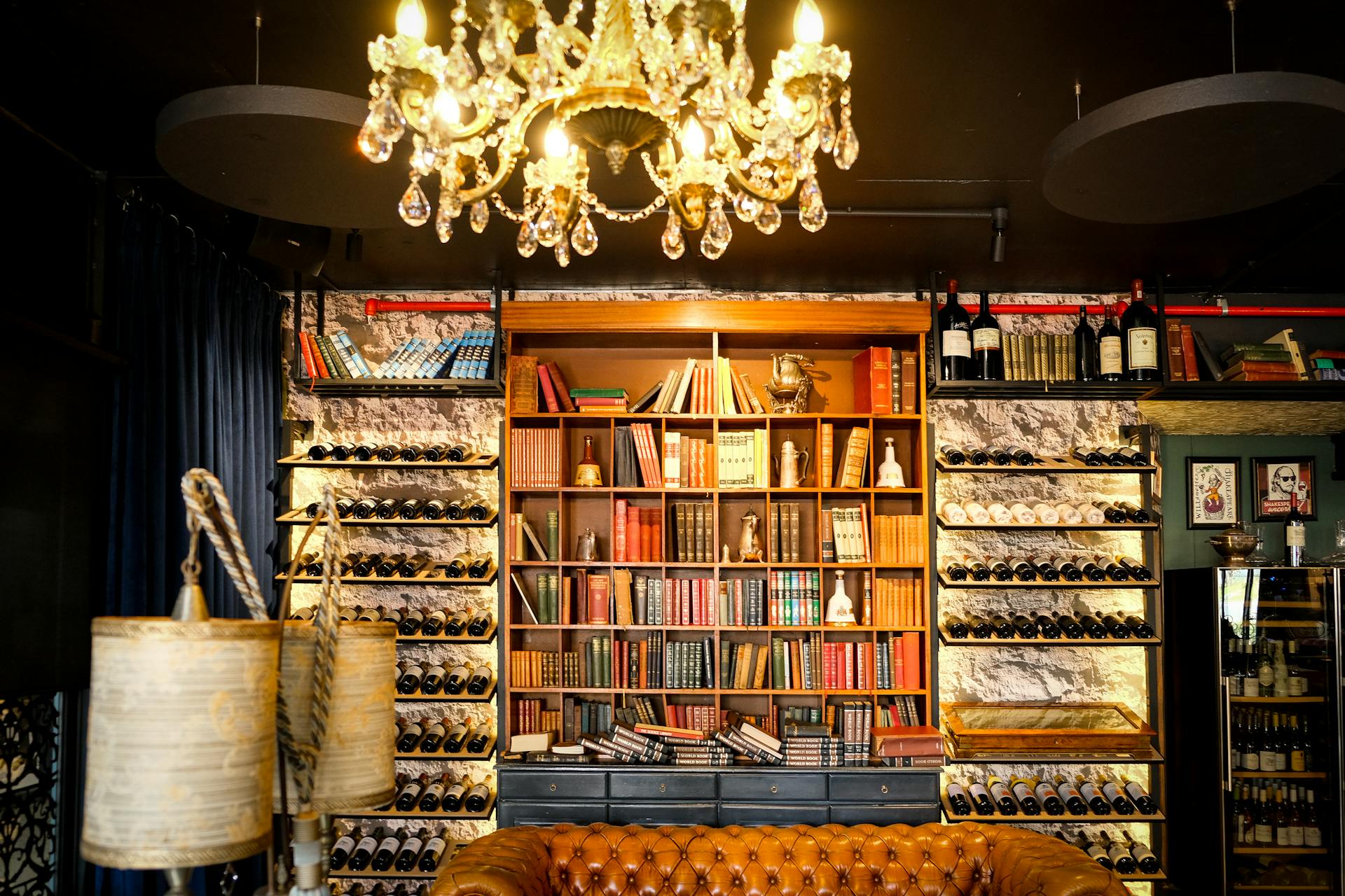 Brown Wooden Book Shelf With Books and Wine Collections