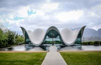 A Modern Building Near the Body of Water Under the Cloudy Sky