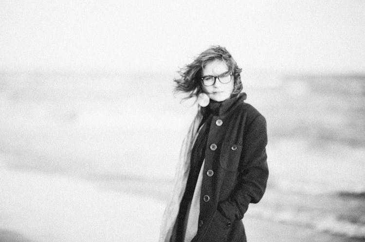 Black And White Grainy Photo Of Woman At Sea