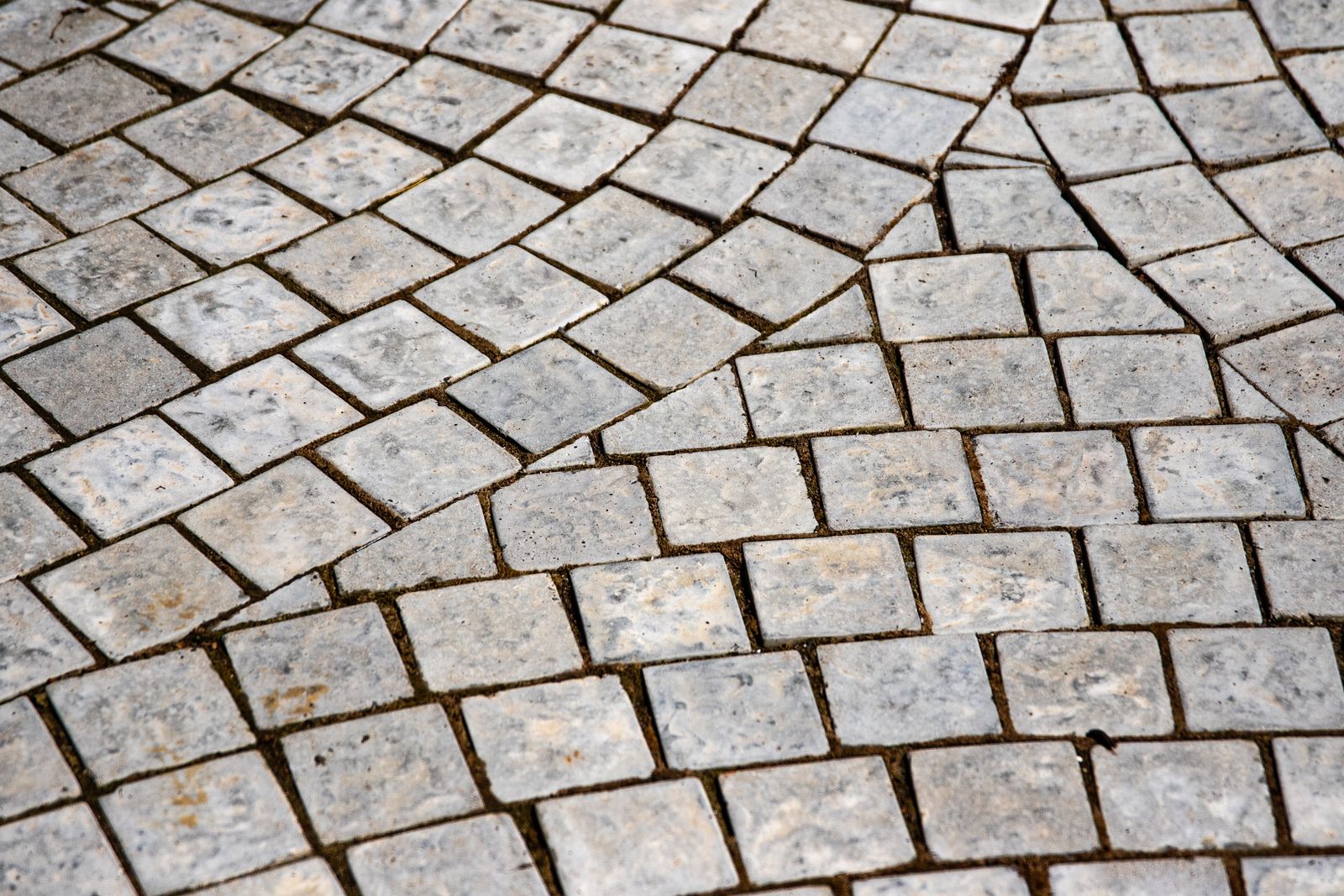 Intricate stone pavement flooring with detailed texture