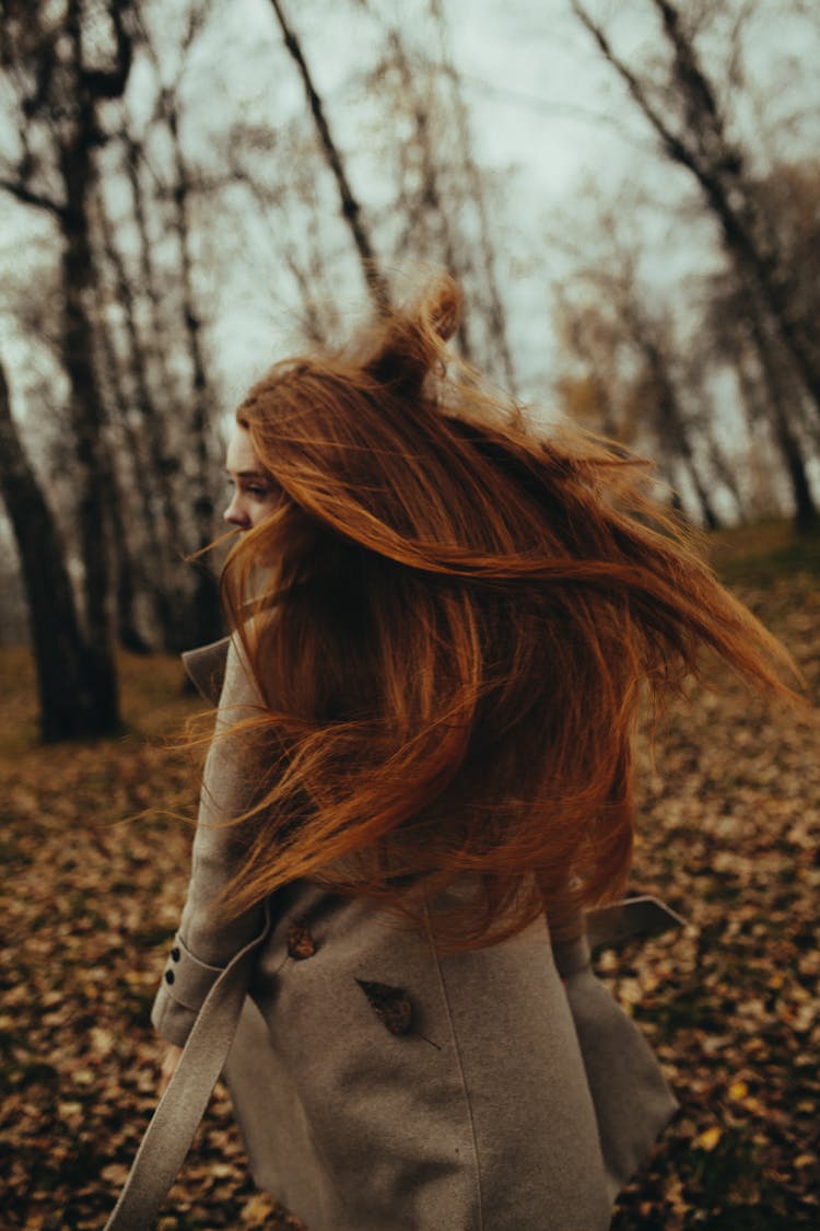 Photography Of Brown-haired Woman Shaking Hair