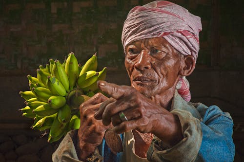 Woman Holding Bananas Figurine