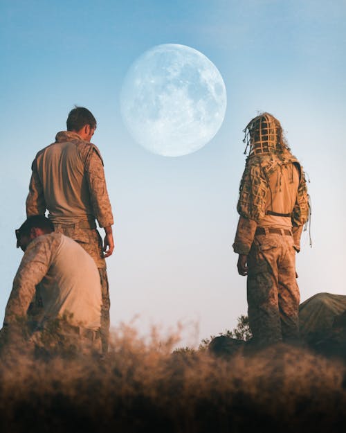 Back View of a Two Men Standing Together 