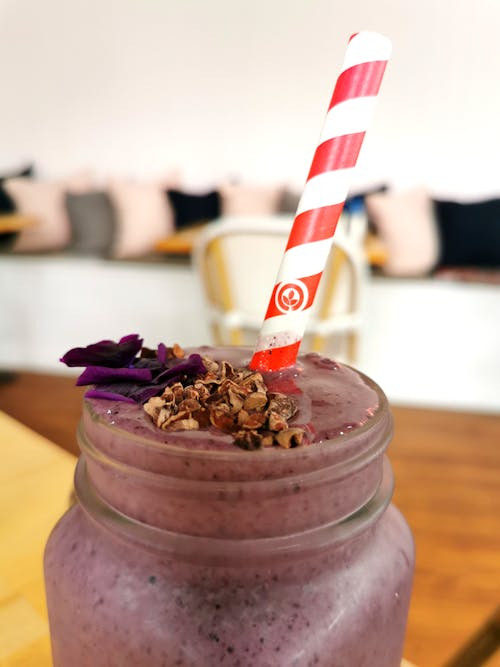 Close-Up Photo of a Purple Smoothie with a Straw