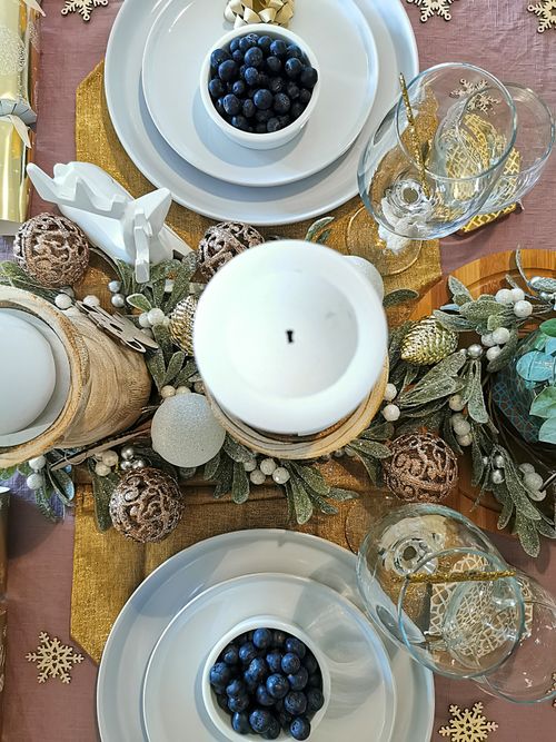 Free Festive holiday table setting with blueberries and winter decorations. Stock Photo