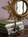 Notebooks on Table under Mirror