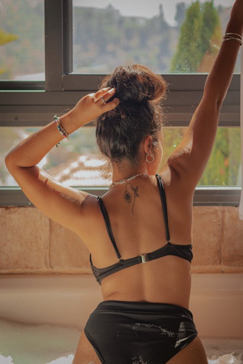 Back View of a Woman in a Black Bikini