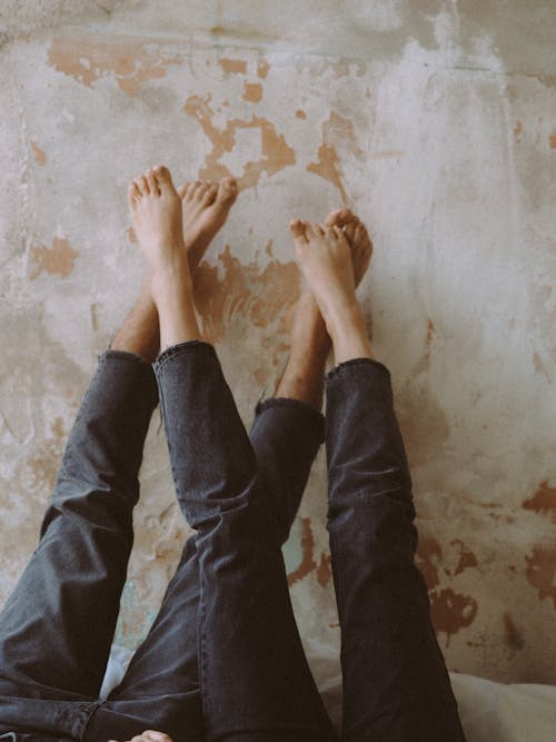 View on Womans and Mans Legs Together