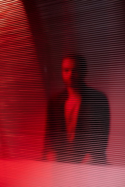 Man Seen through Curtain