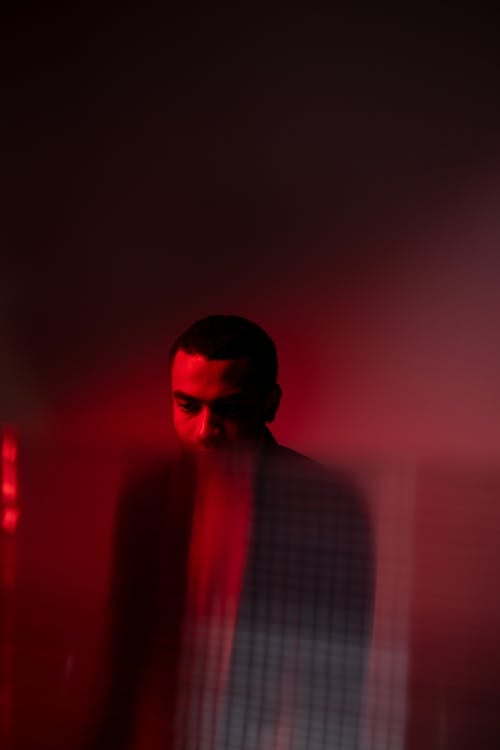 Man in a Room with Red Light 