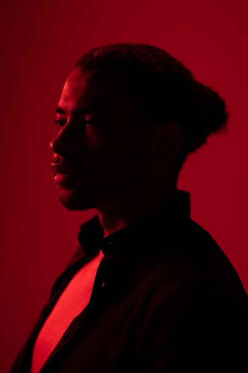 Profile View of Man in Red Light