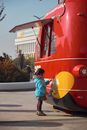 Child in Front of Food Booth