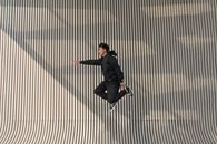 Man in Hoodie in Mid-Air