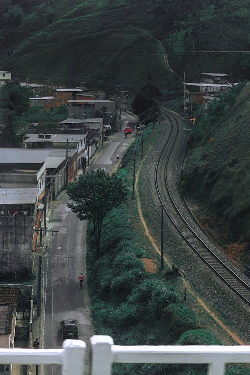 Aerial View of Railroad Between Houses and Green Mountain