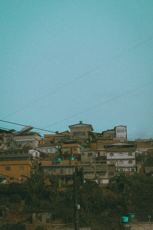 Free A vibrant view of densely packed houses on a mountainside, capturing urban architecture. Stock Photo
