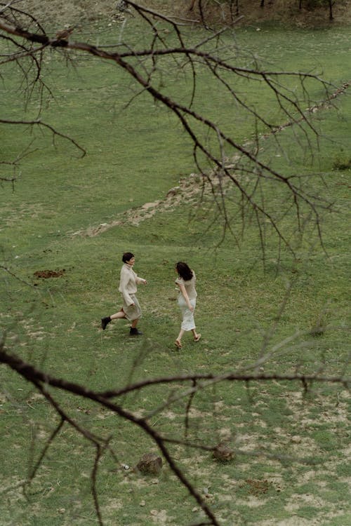 Women Running on Grass