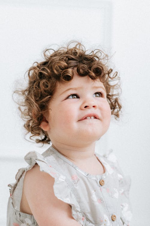 Free Child with Brown Curly Hair Stock Photo