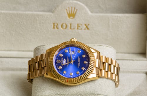 Free A Blue and Gold Rolex Wristwatch Stock Photo
