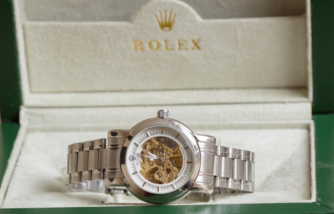 Free A Silver Mens Rolex Watch in a White Case Stock Photo