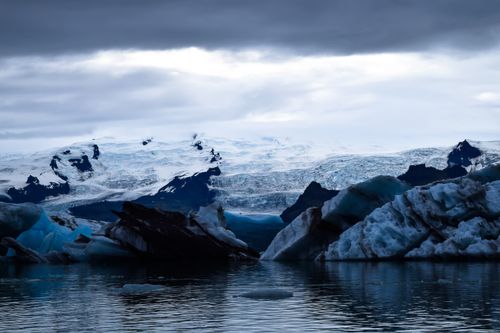 Free Breathtaking view of icy glaciers and icebergs in a tranquil ocean setting. Stock Photo