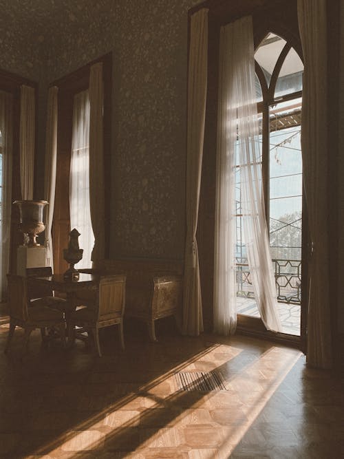 Brown Wooden Chairs Near Window