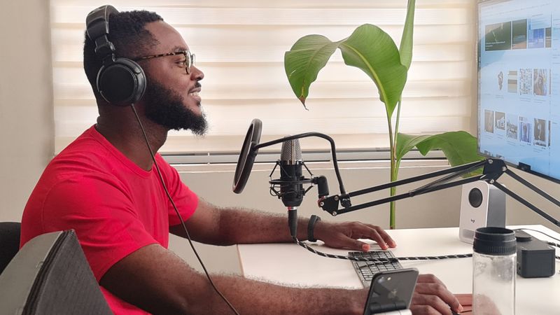 Podcast host recording professionally with headphones