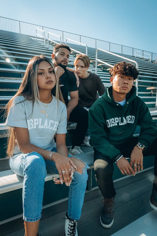 A People Sitting on a Stadium Bench