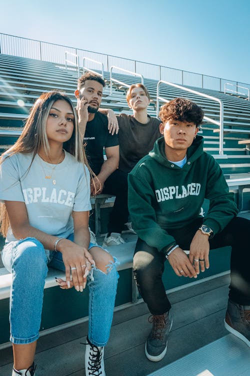 A Group of People Sitting on Bleachers