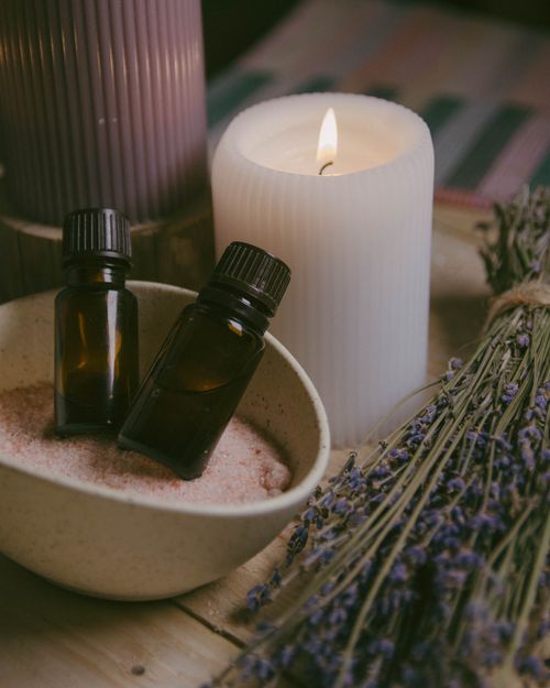Free Close-up of essential oils, candles, and lavender for a calming spa ambiance. Stock Photo