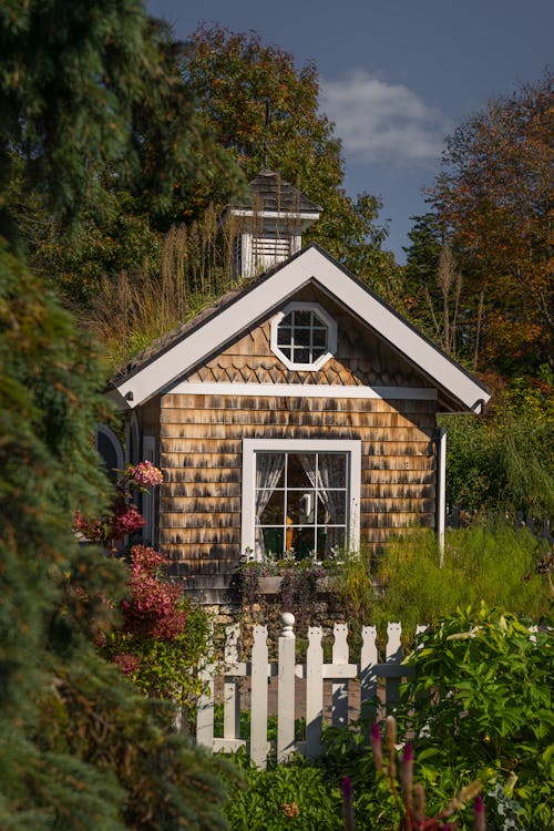 White and Brown House Beside Green Trees