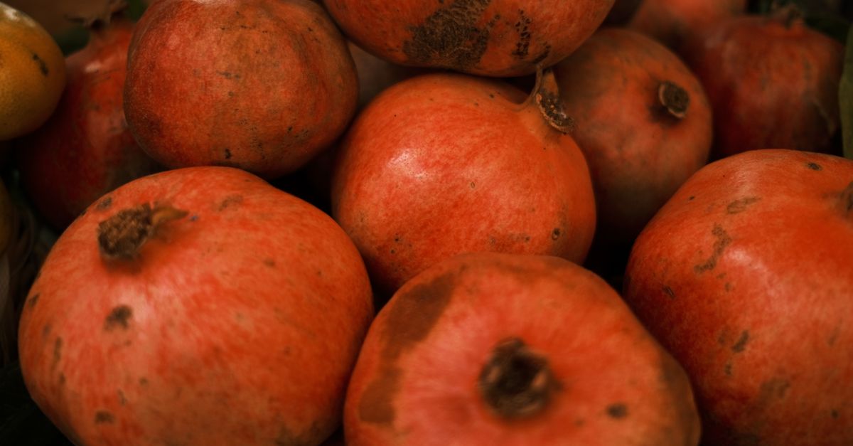 A vibrant close-up of fresh ripe pomegranates showcasing their natural texture and rich color. - Evidence evidence guide for pomegranate skin aging randomized trial