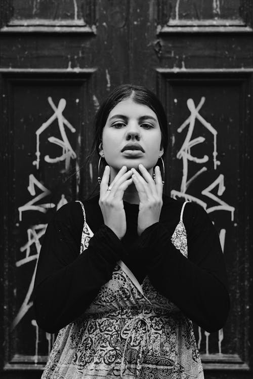 Young Woman Standing in Front of Door 