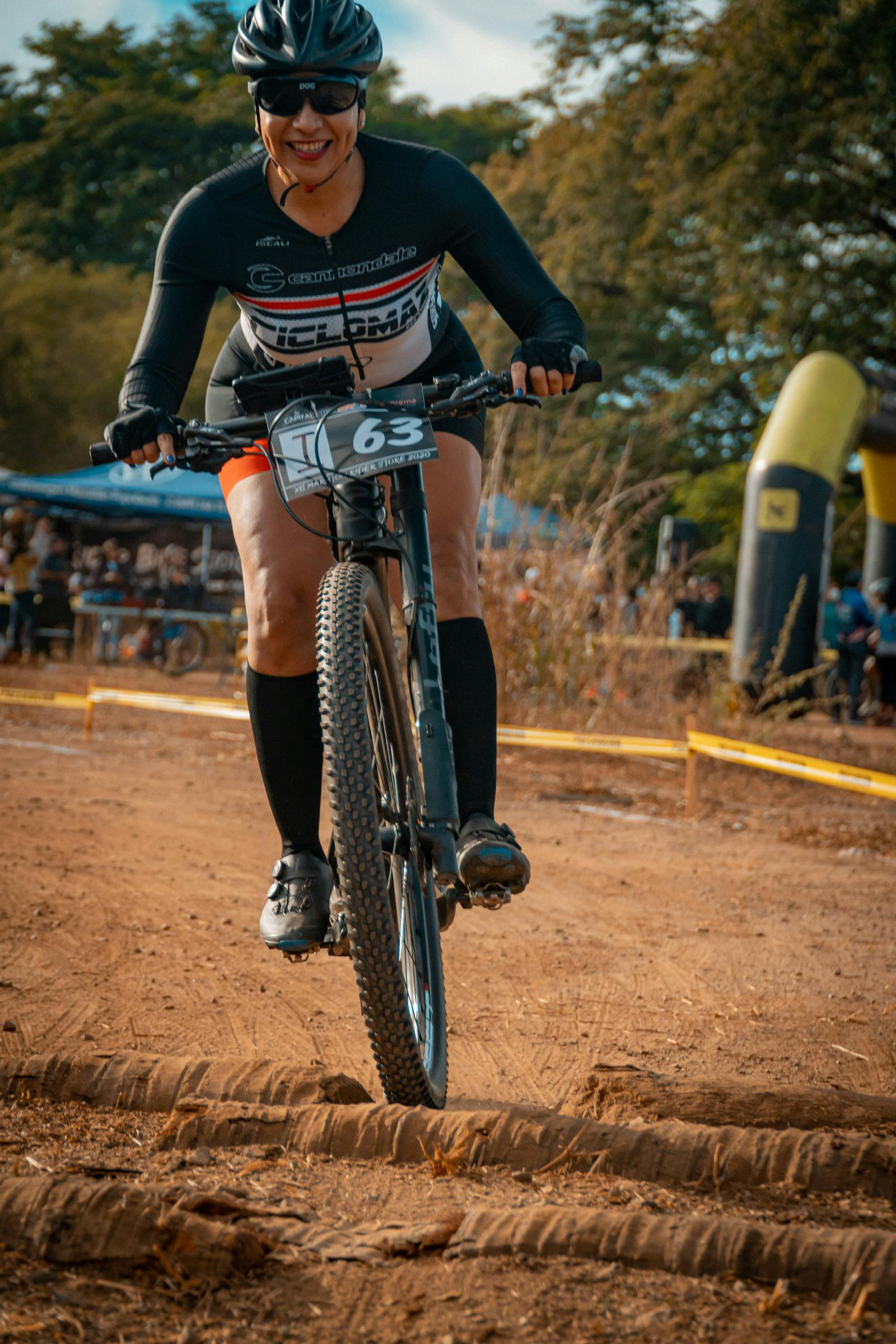 A close-up of a diamond bracelet on a woman’s wrist at a formal event