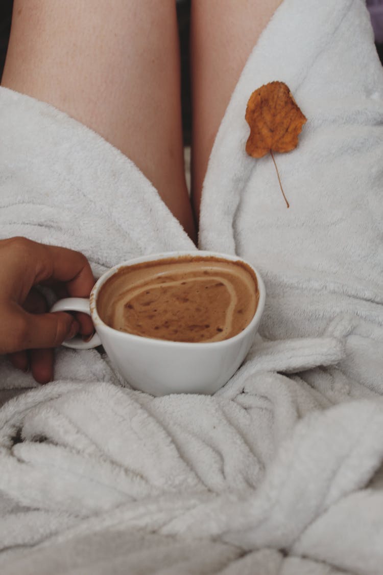 Woman Holding Cup Of Cappuccino