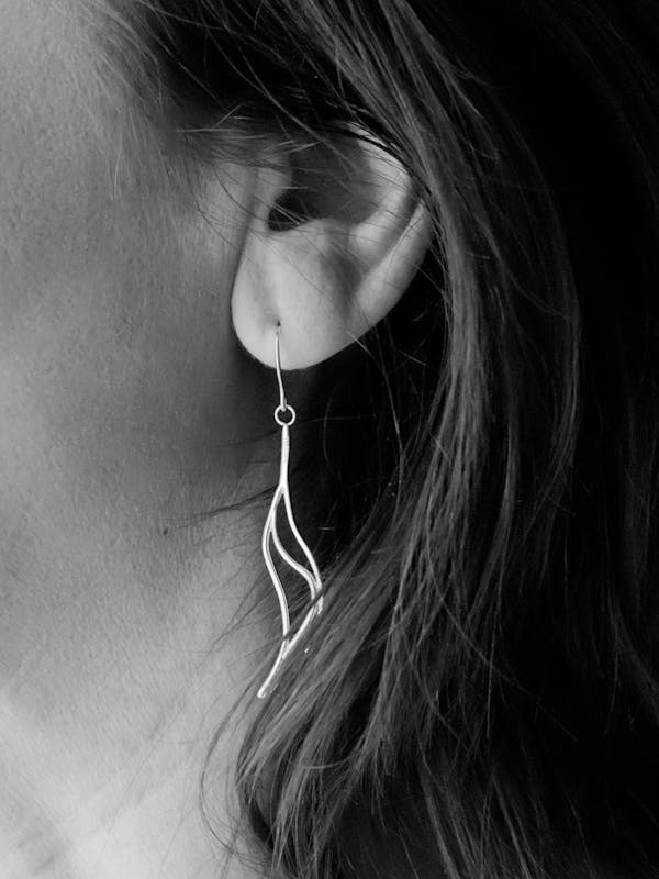 Grayscale Photo of Woman's Hook Earrings