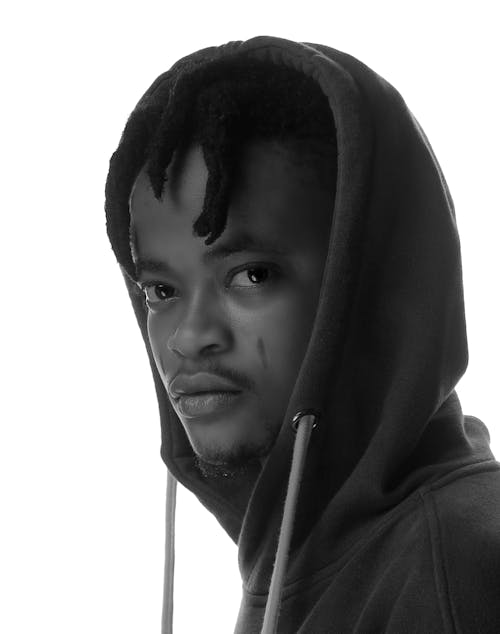 Grayscale Photo of a Man Wearing a Hoodie