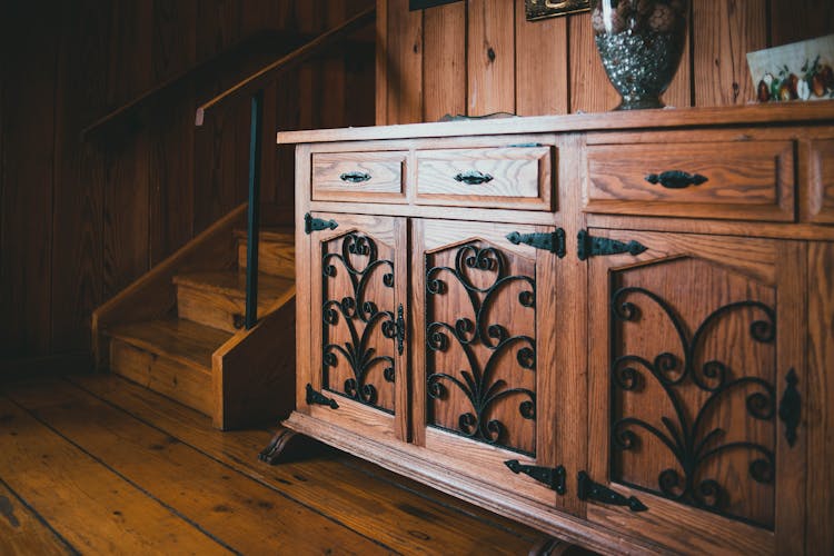 Wooden Commode Near Stairs