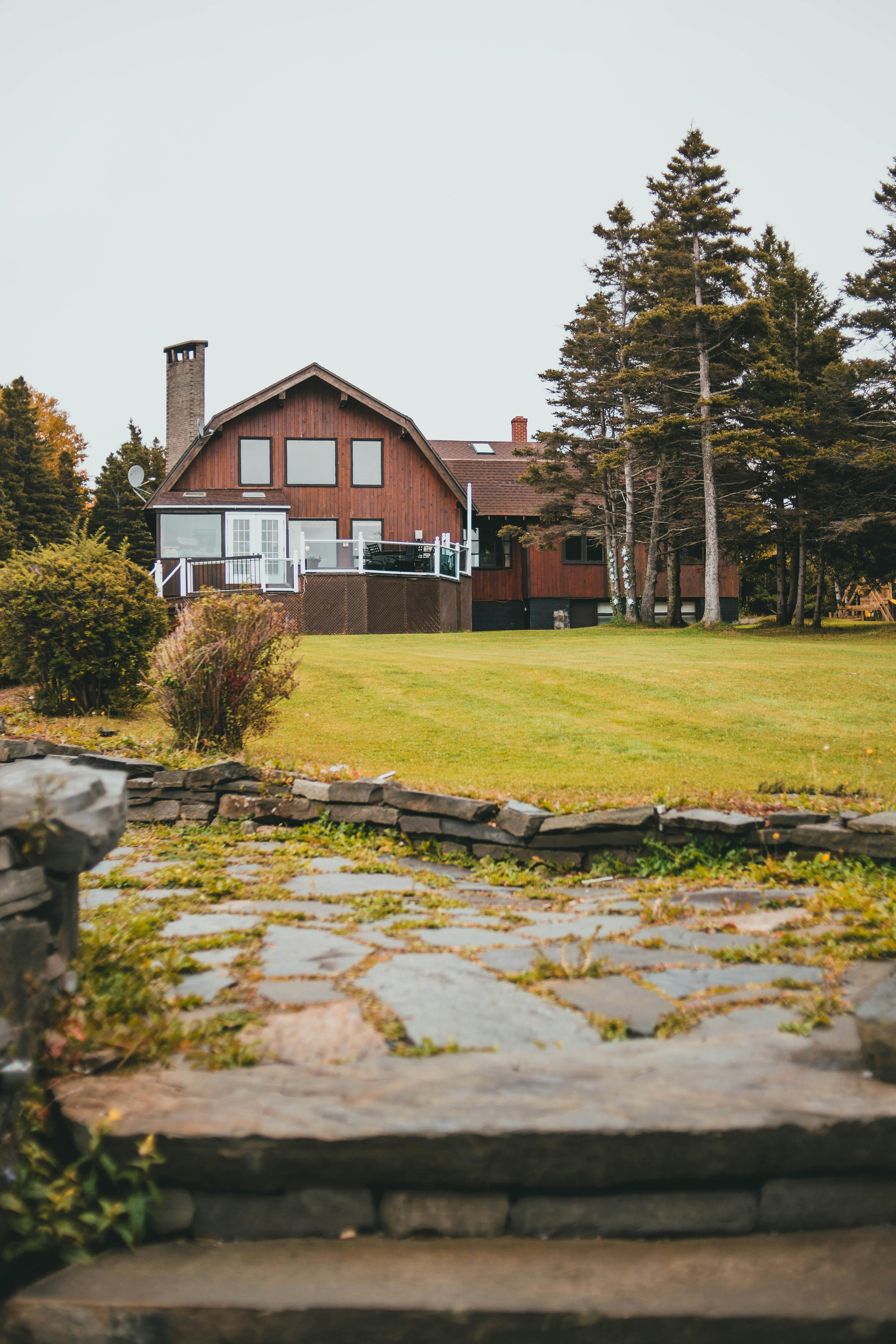 stone stairs near big wooden house