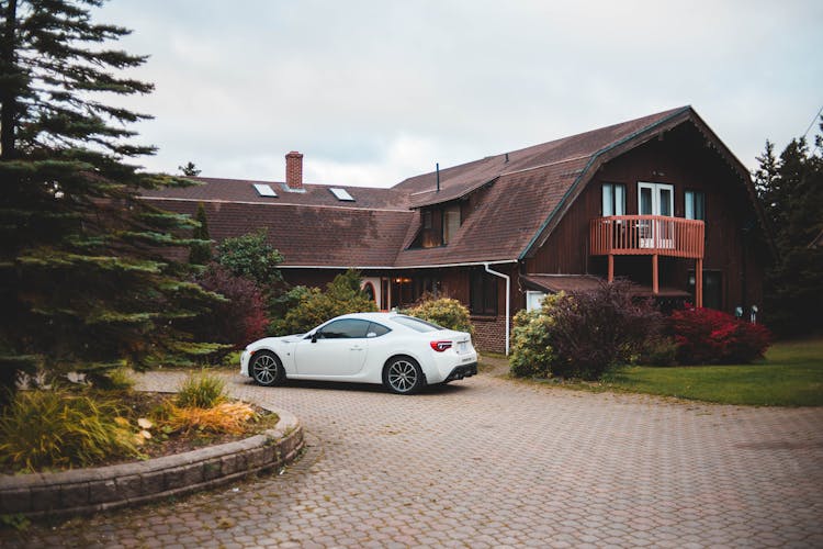 White Car Parked Near House