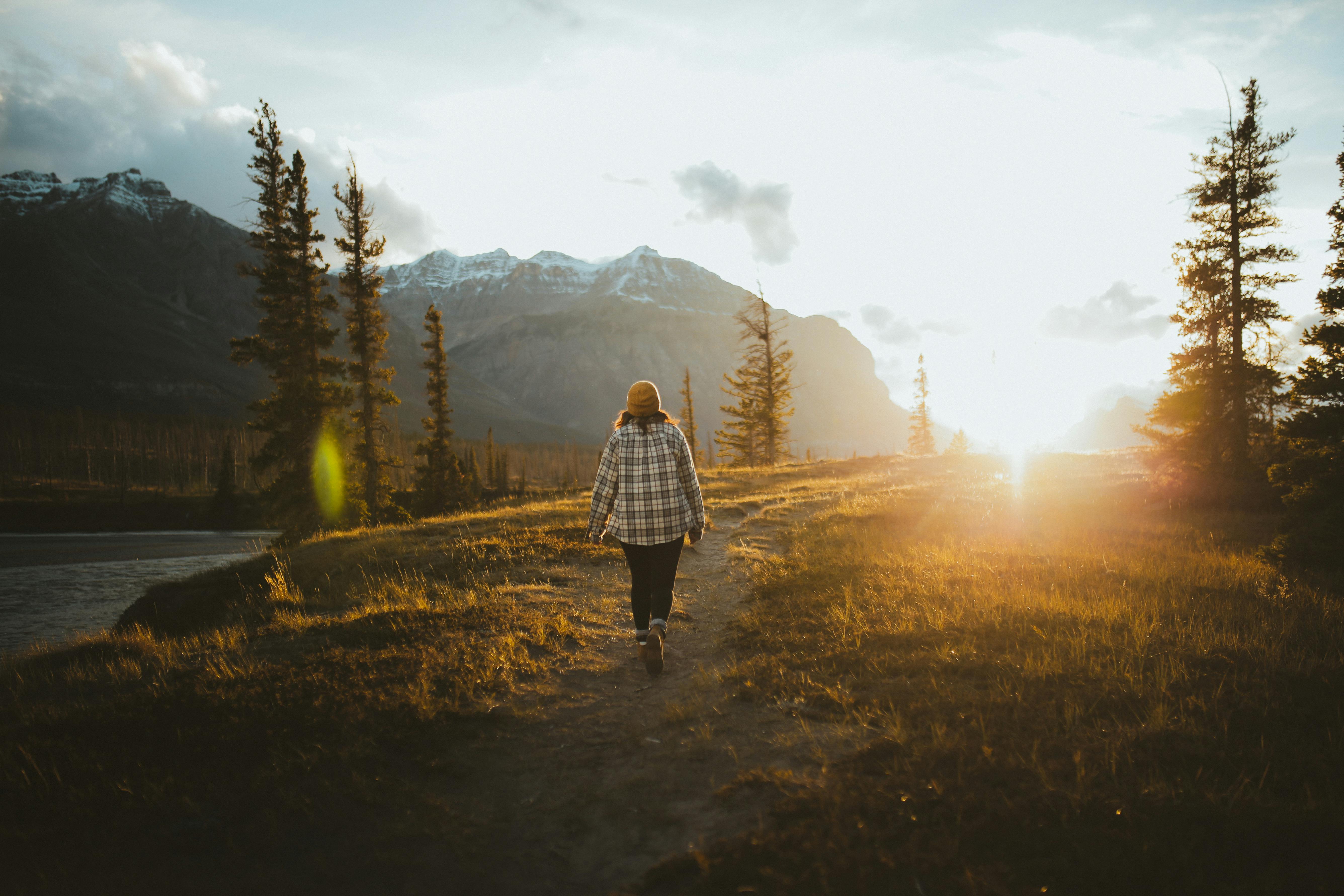 a person walking during sunset