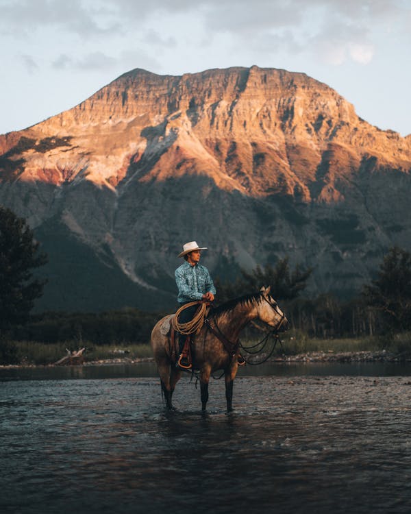 Cowboy riding a Horse on the River