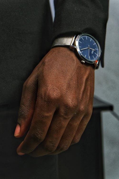 Person Wearing a Silver Wristwatch