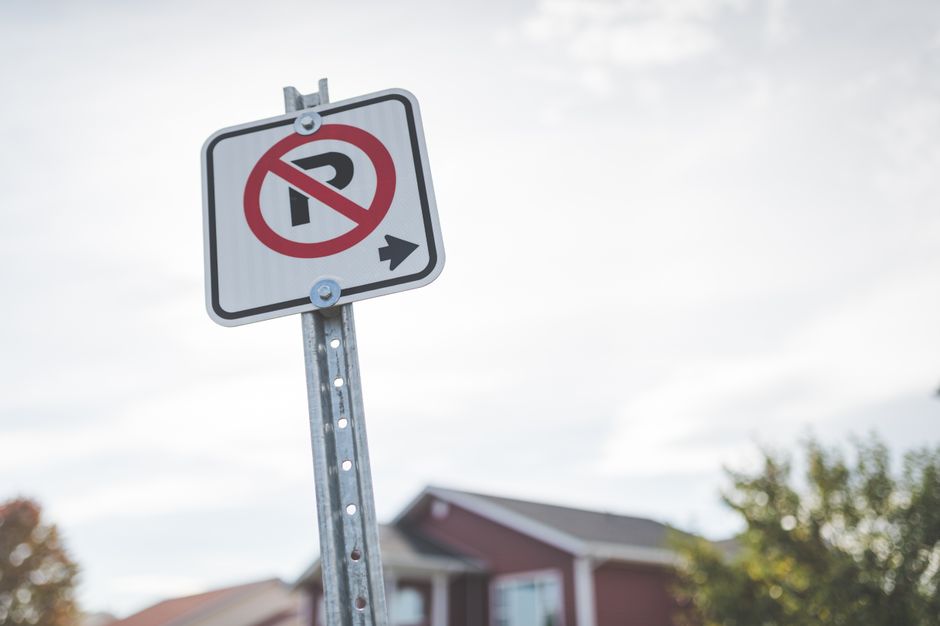 close-up parking regulation sign residential street curb