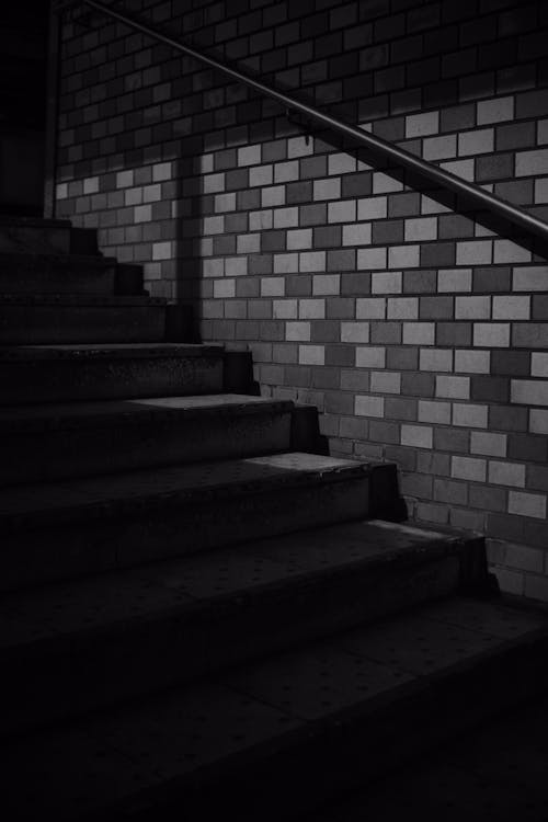 Grayscale Photo of a  Concrete Staircase